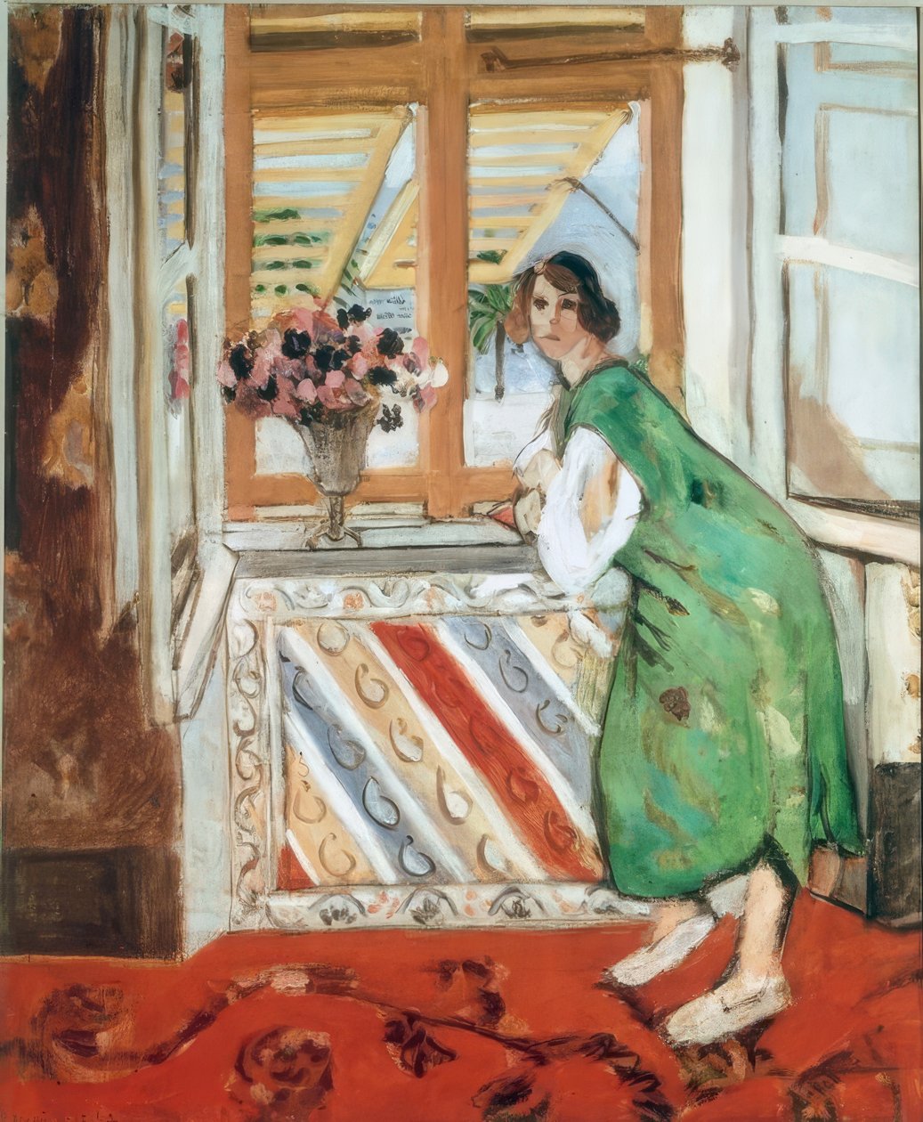 Interiör i Nice, eller, Ung kvinna i grön klänning lutar sig mot av Henri Matisse