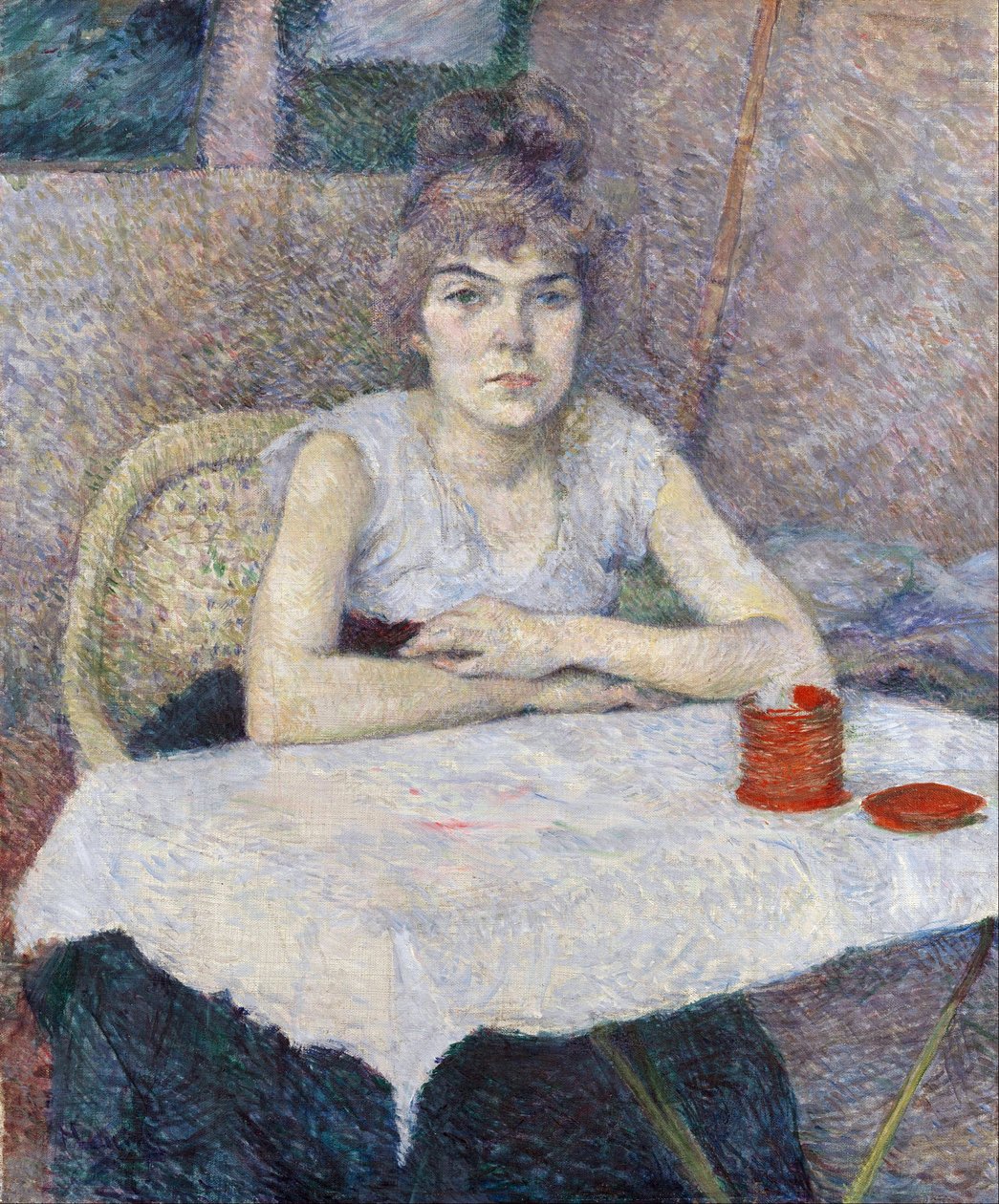 Ung kvinna vid ett bord av Henri de Toulouse Lautrec