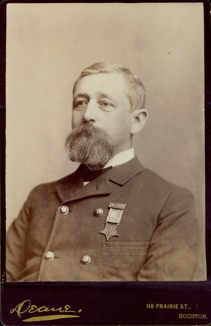 Bust portrait of Alfred K. Taylor, turned to the left, and wearing a double-breasted jacket with a medal pinned to it.  av Houston Deane