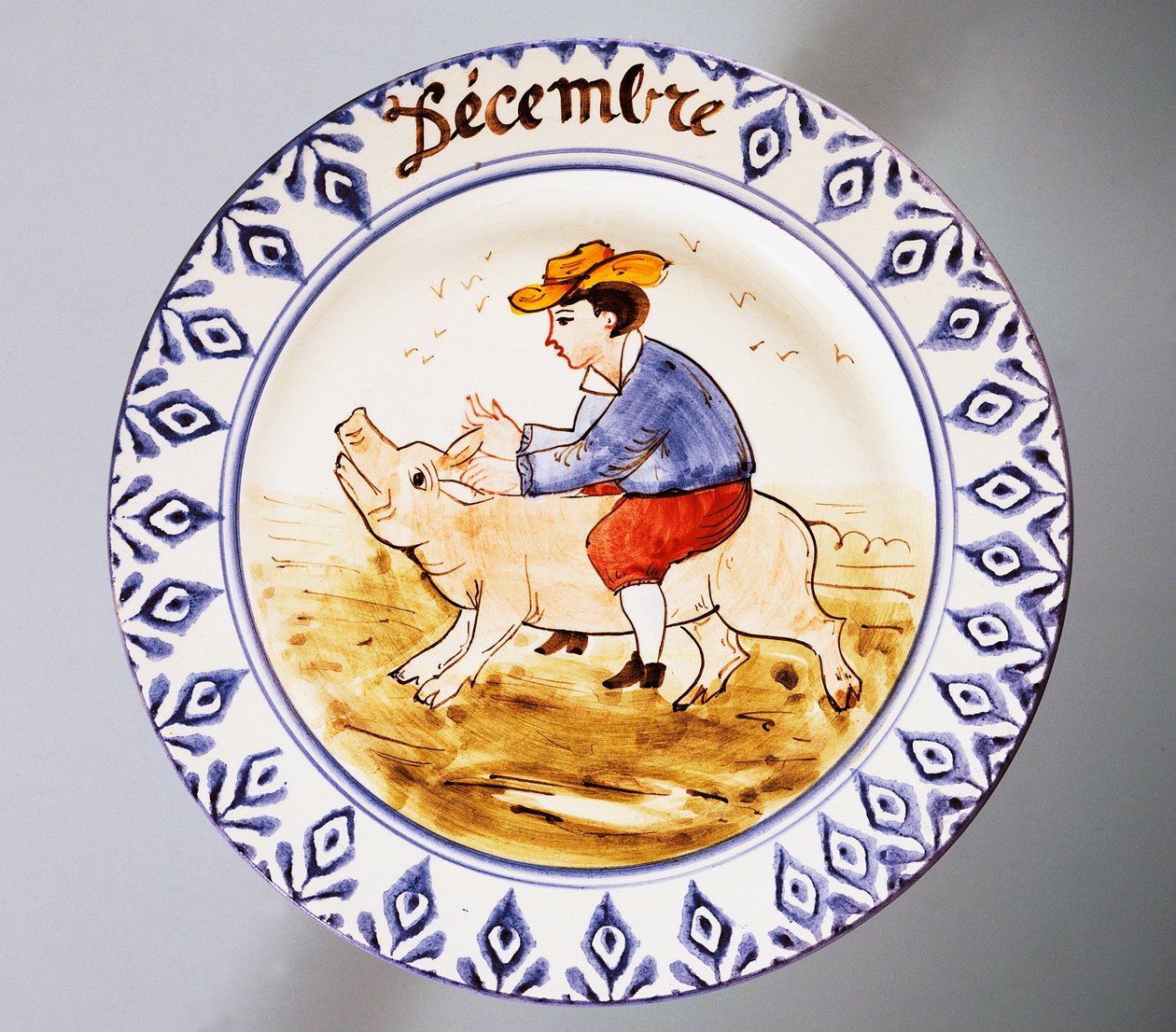 Tallrik med månader, december, lergods, tillverkning Nove di Bassano, regionen Veneto, Italien, 1900-tal. av Italian School