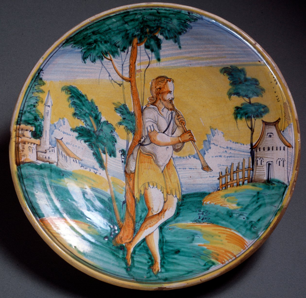 Renässanskonst: tallrik dekorerad av en flöjtspelare (En flöjtspelare) - Slutet av 1500-talets produktion av Viterbo (Viterbo), Italien Florens, Museo Nazionale del Bargello av Italian School