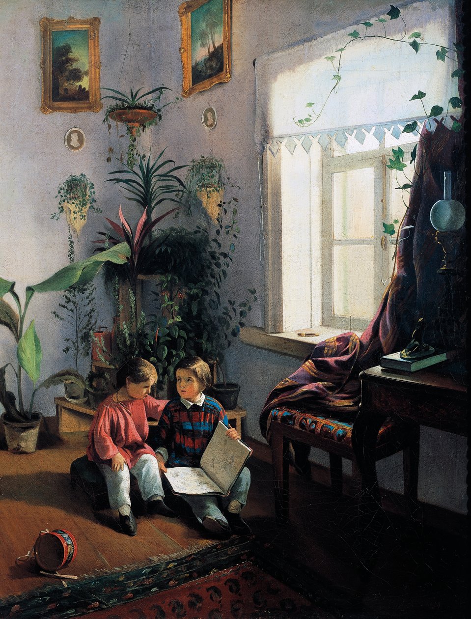 Barn som bläddrar i bilderbok av Ivan Khrutsky