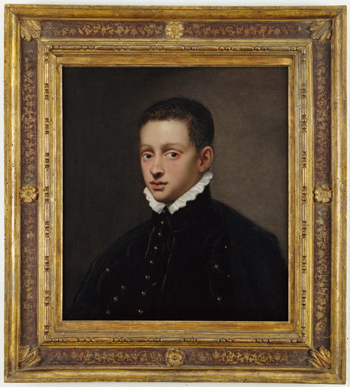 Porträtt av en pojke, bystlång, i en svart dubblett med vit krage av Jacopo Robusti Tintoretto