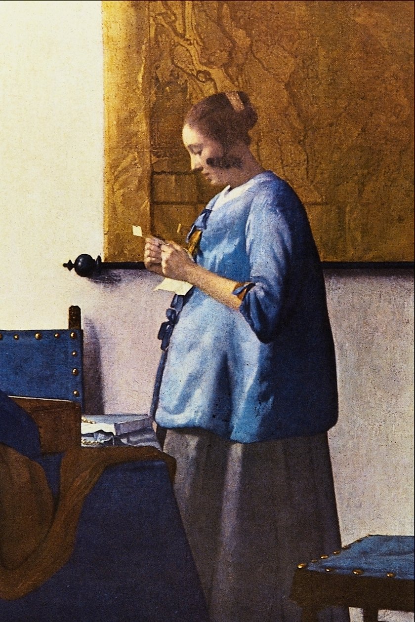 Woman reading a letter av Jan Vermeer van Delft