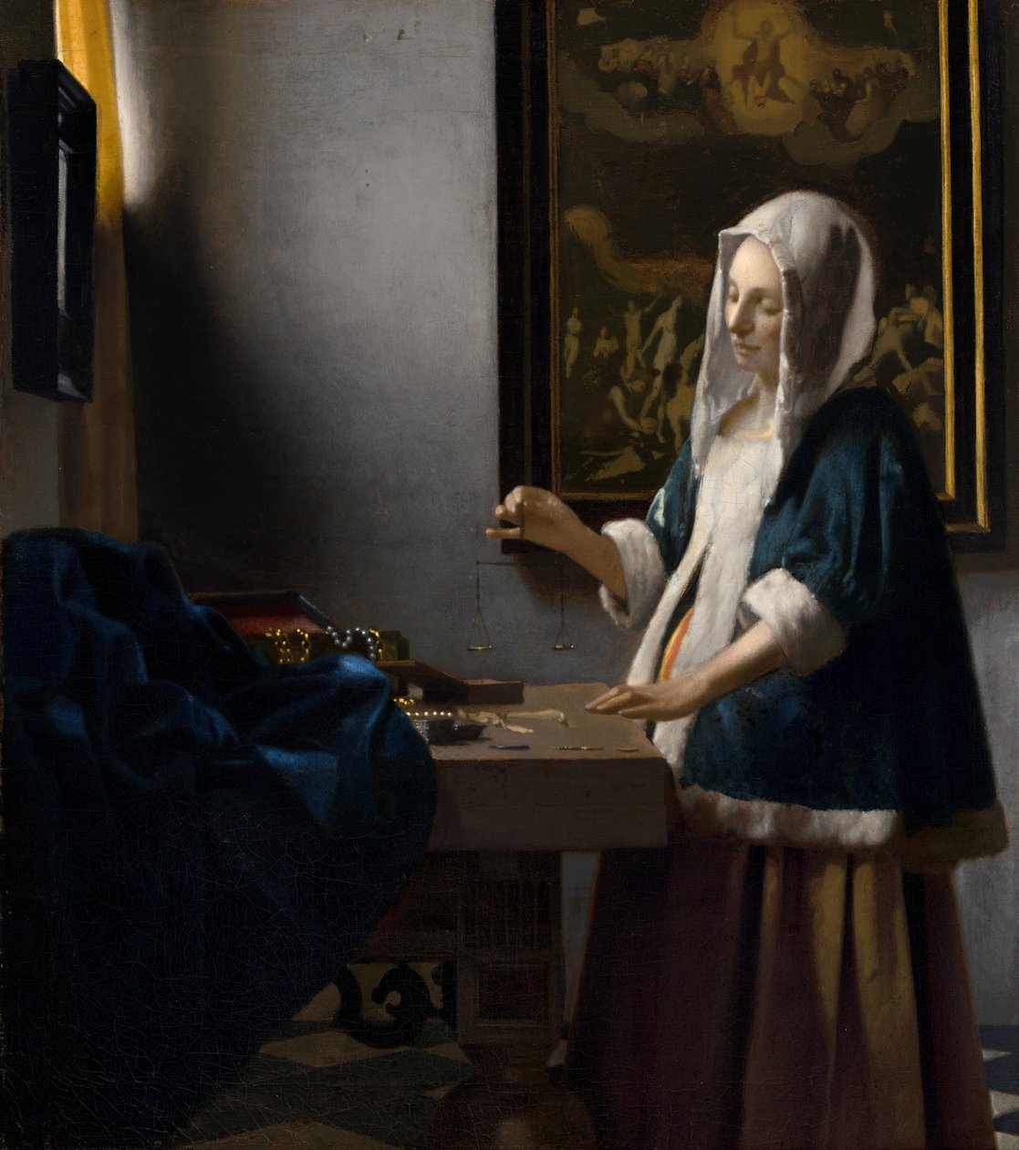 Kvinna som håller en balans, c. 1664. av Johannes Vermeer