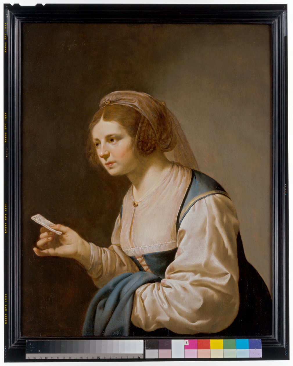 En ung flicka håller i ett brev av Jan van Bijlert or Bylert