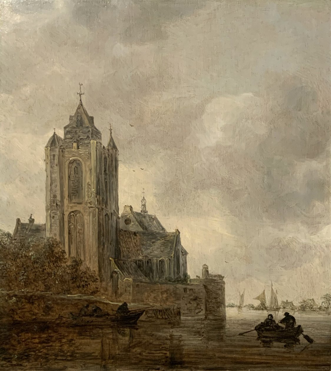 En kyrka på stranden av en flod. av Jan van Goyen