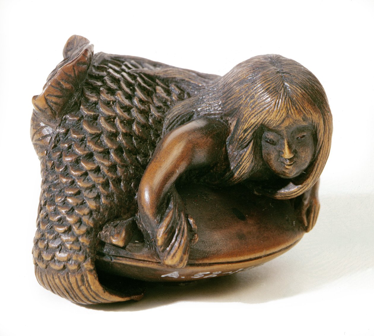 Netsuke snidad i form av en sjöjungfru av Japanese School