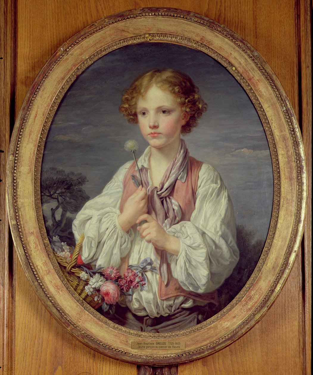 Ung pojke med en korg med blommor av Jean Baptiste Greuze