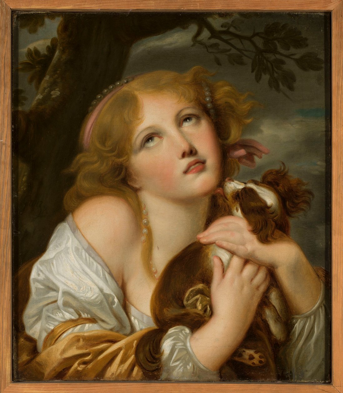 Flicka med en hund i famnen av Jean-Baptiste Greuze