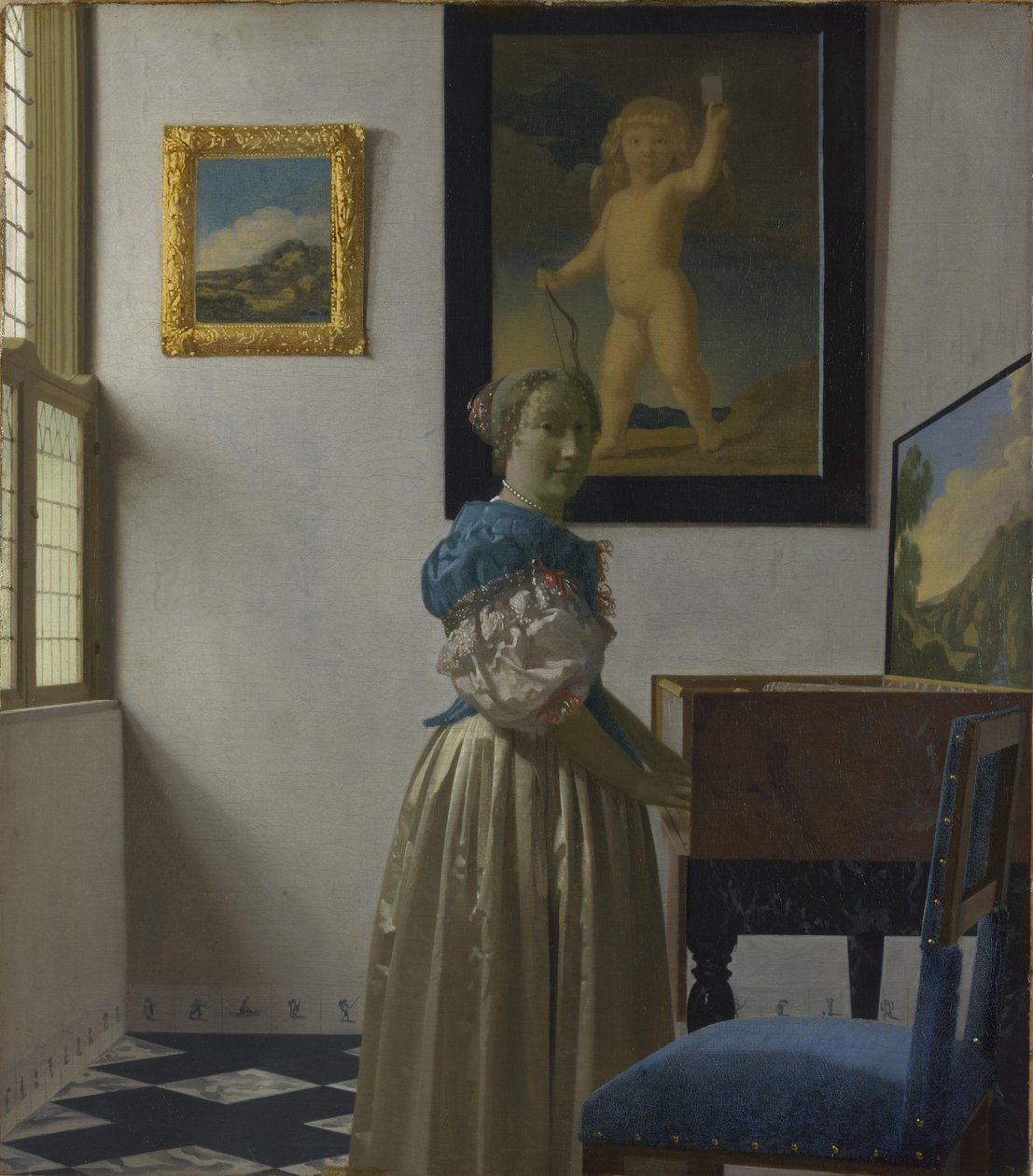 En ung kvinna står vid en jungfru av Johannes Vermeer