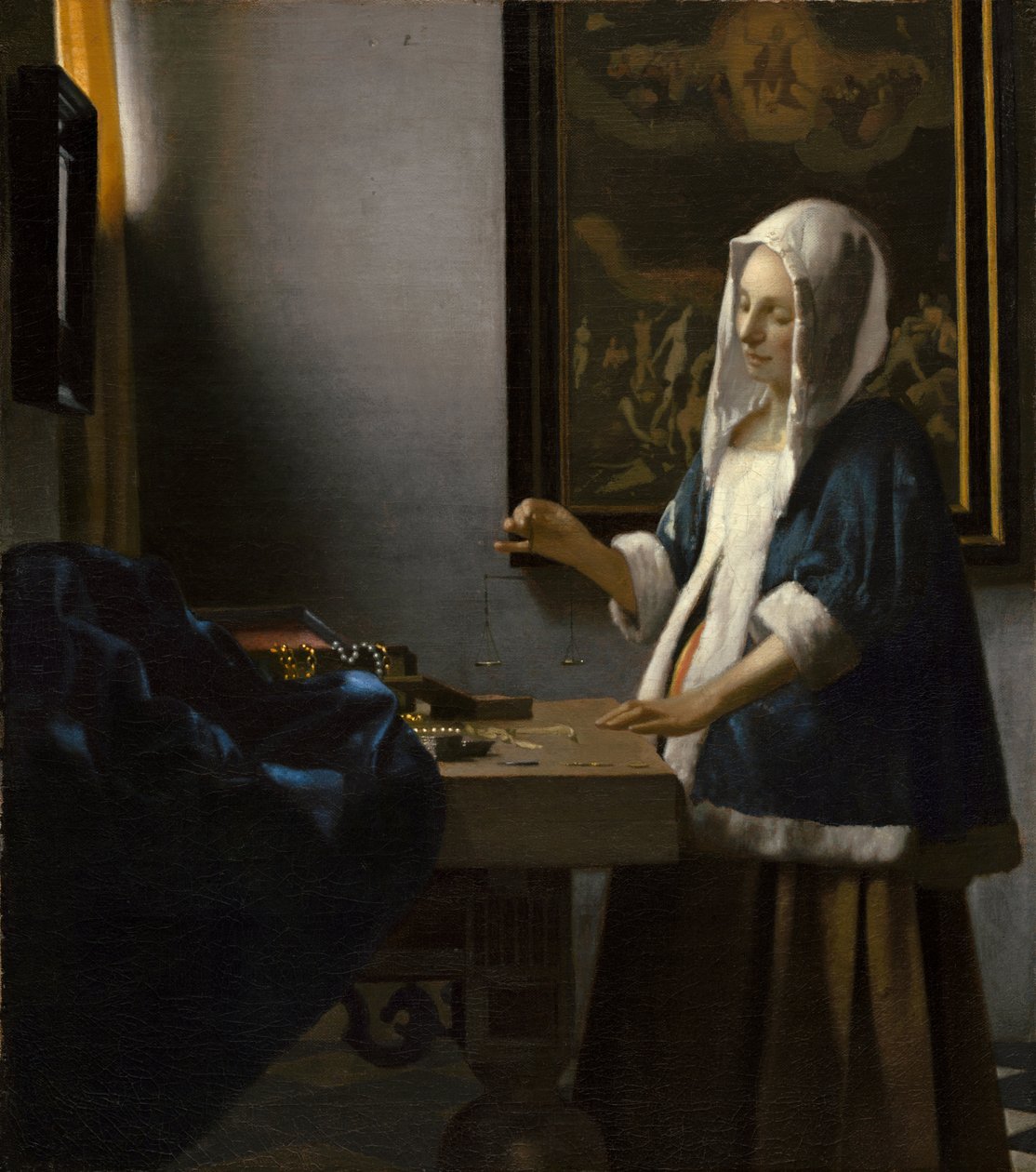 Kvinna som håller en balans av Johannes Vermeer