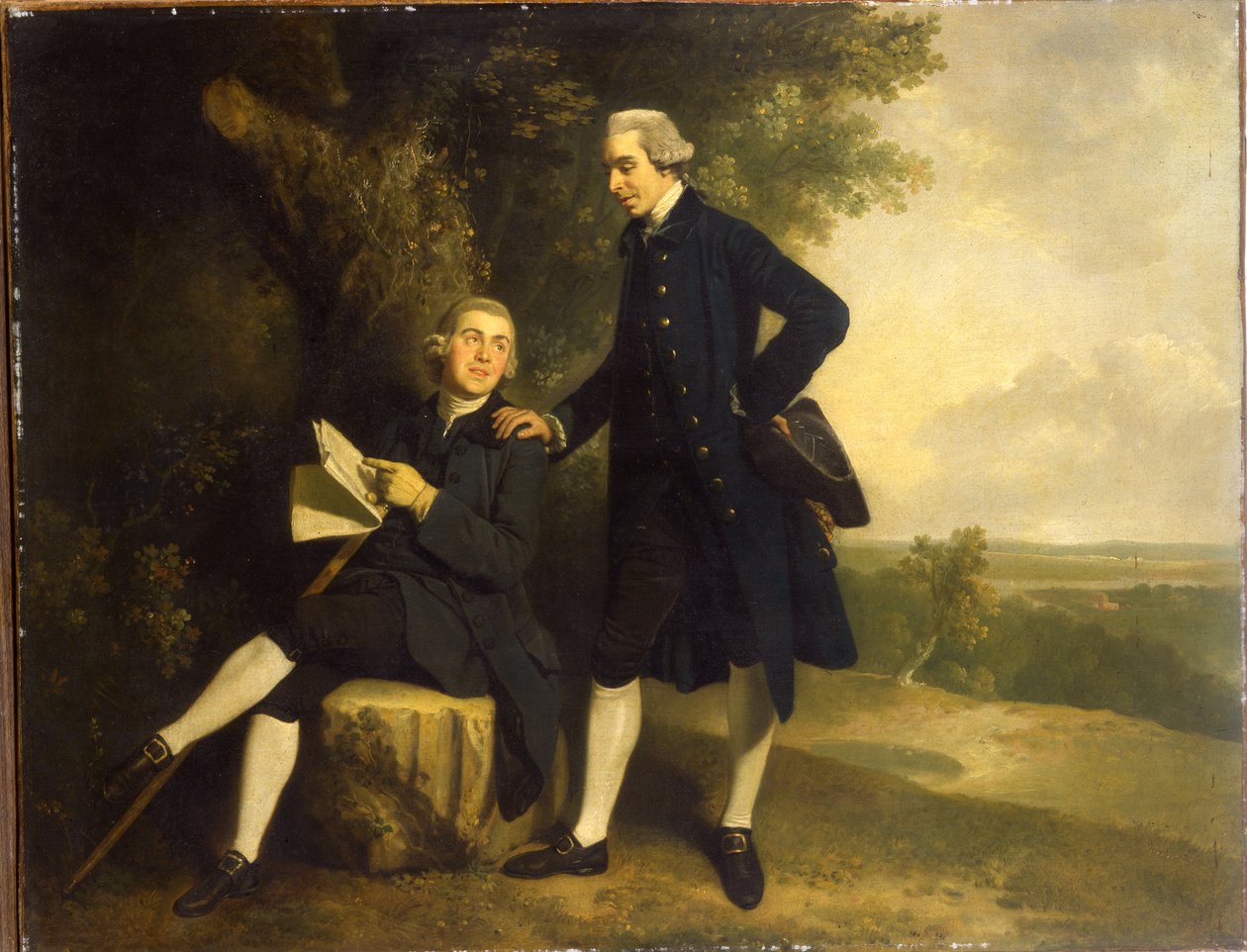 Dubbelporträtt av Thomas Somers Cocks och Richard Cocks från Castleditch, båda små i full längd, den förra i en blå kappa och väst som håller en svart trehörning, den senare sitter i en blå kappa och väst med ett manuskript, i ett landskap, av John Hamilton Mortimer
