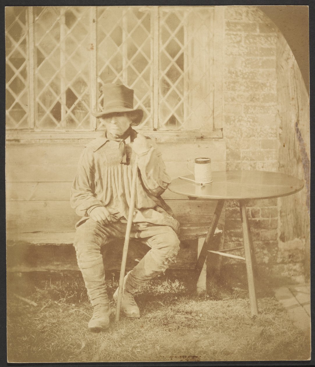 [Man som sitter vid bordet] av John Whistler