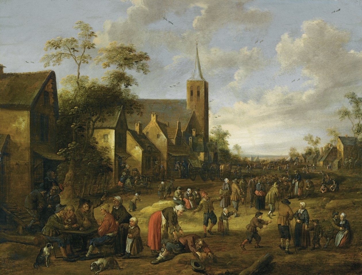 En livlig bysträcka med många figurer, bönder som äter och dricker vid ett bord i förgrunden, ett kyrktorn bortom av Joost Cornelisz Droochsloot