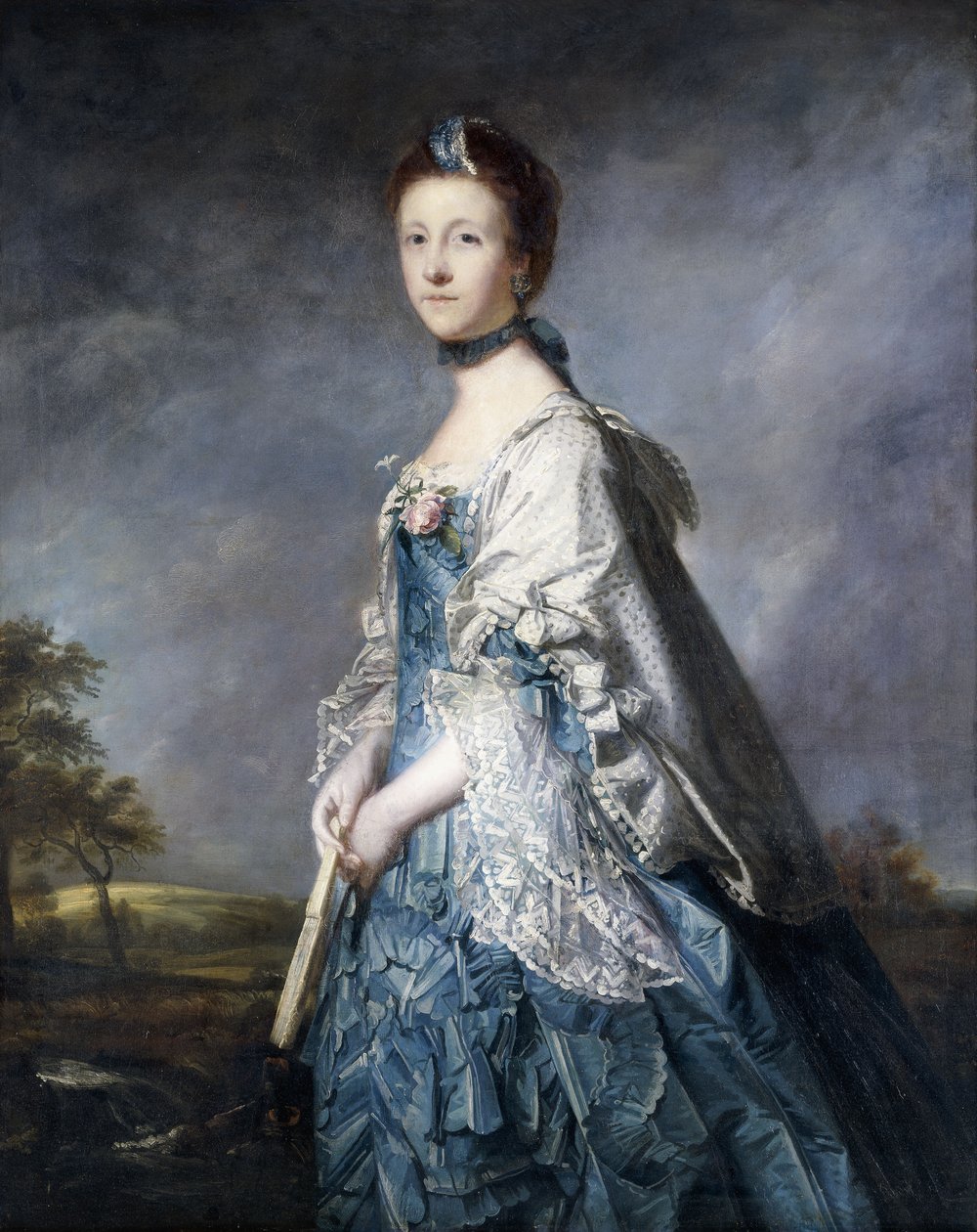 Porträtt av Anne, grevinnan Winterton, stående trekvartslängd, iklädd en blå klänning, och spetsklippt sjal, håller en solfjäder, i ett landskap, av Joshua Reynolds