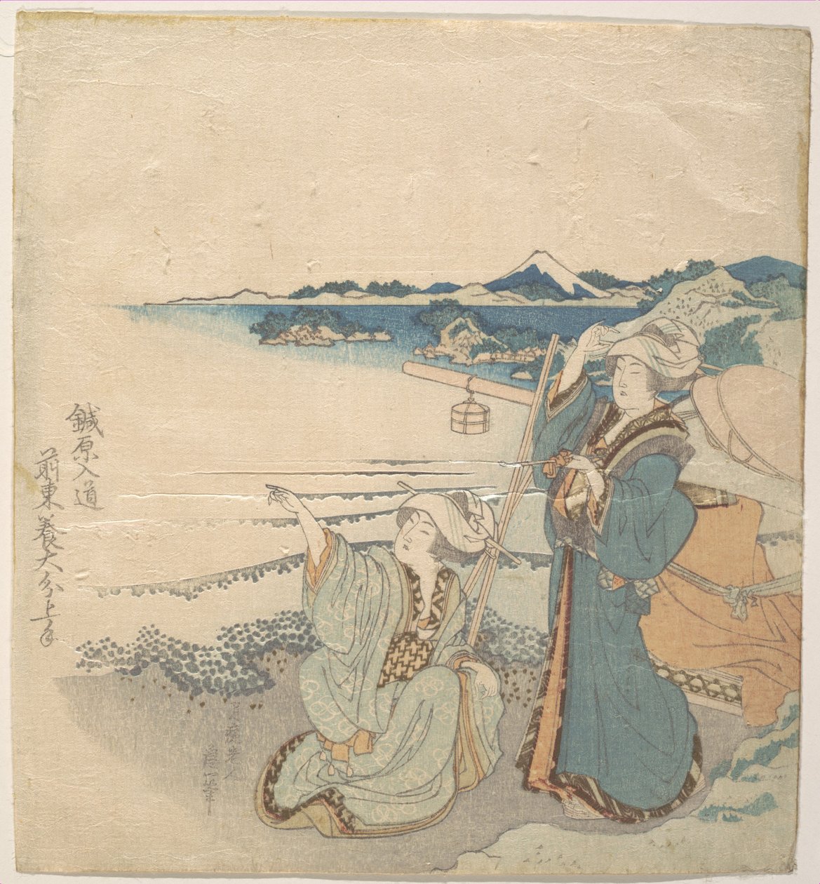 Två unga damer vid stranden; en av dem pekar av Katsushika Hokusai