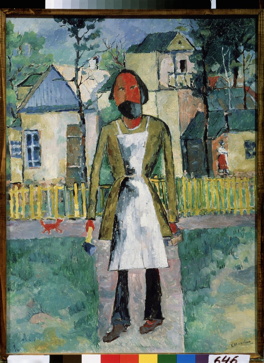 En snickare (A Carpenter). Hantverkaren står framför en by på landet, han är klädd i sitt arbetsförkläde och håller sina verktyg i var sin hand. Målning av Kasimir Severinovich Malevitch (Malevich, Malevic) (1878-1935), olja på trä av Kazimir Severinovich Malevich
