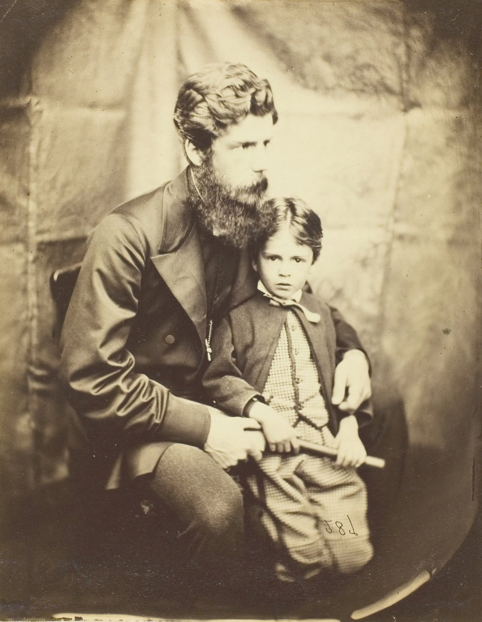 Pastor James Langton Clark och son Charles Robin, 1864. av Lewis Carroll