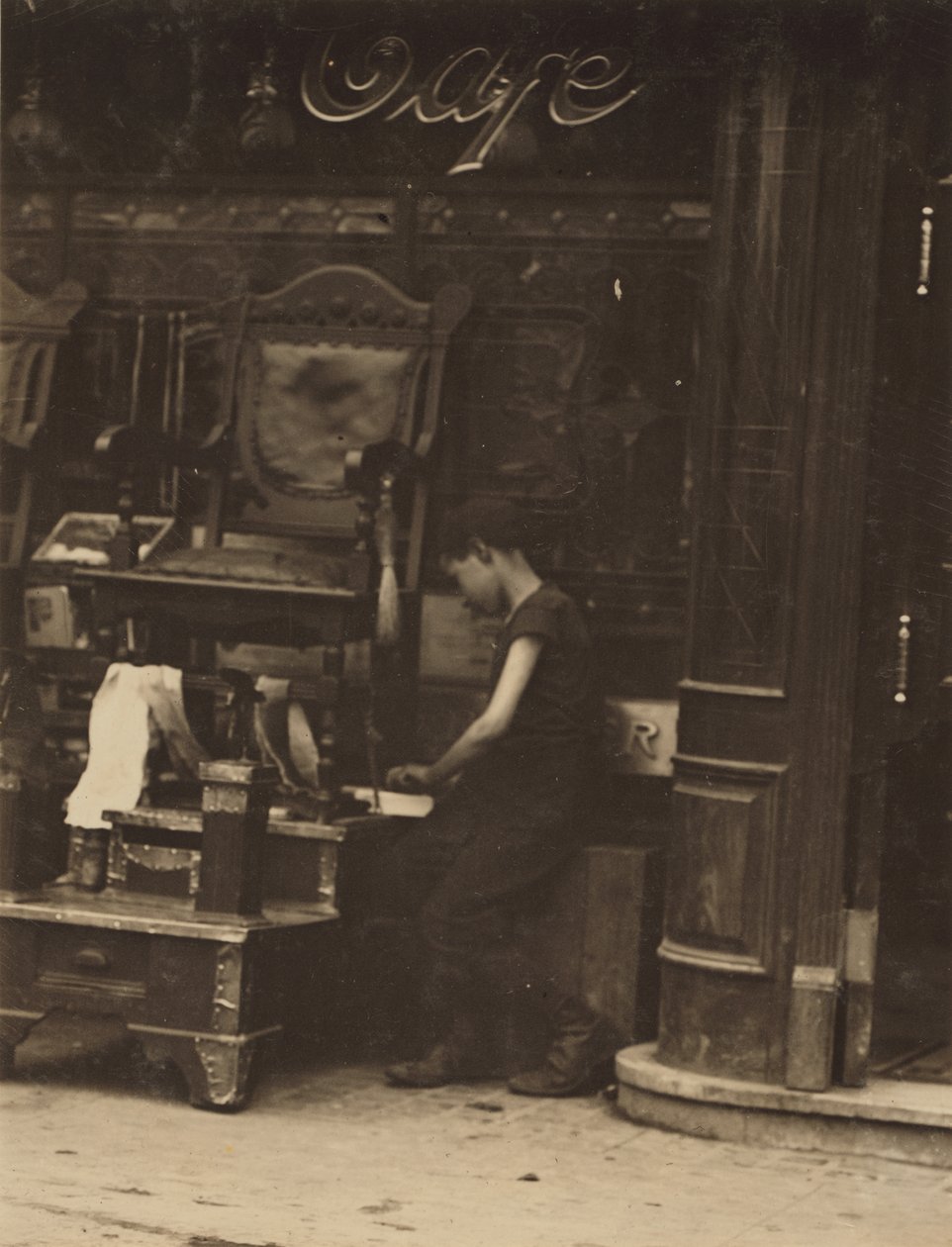 En ung bootblack arbetar på Canal Street i New York City av Lewis Wickes Hine