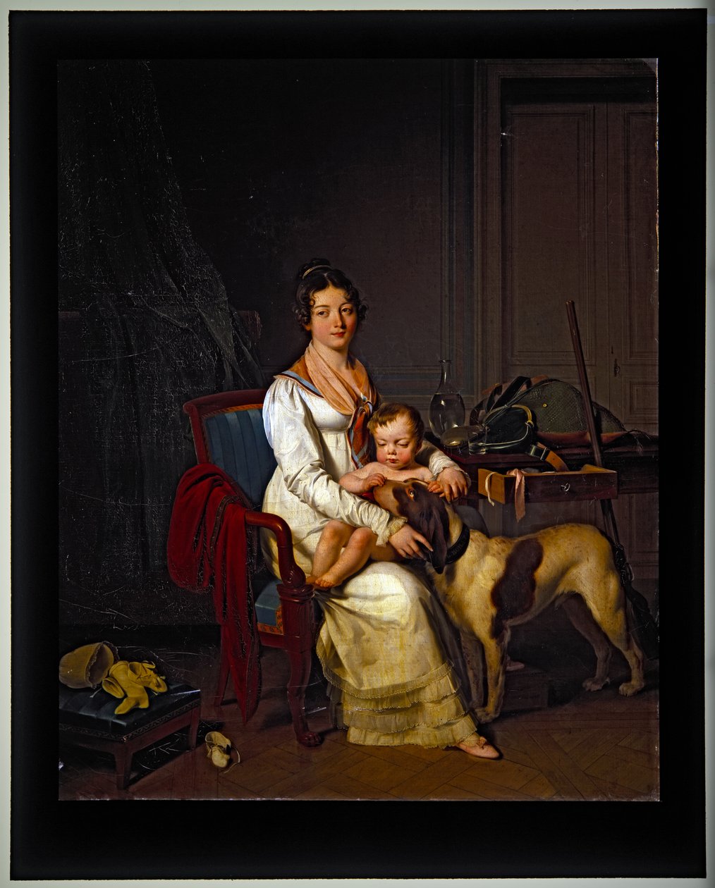 En ung dam med ett barn och en hund i en interiör, odaterad (på duk) av Louis Leopold Boilly