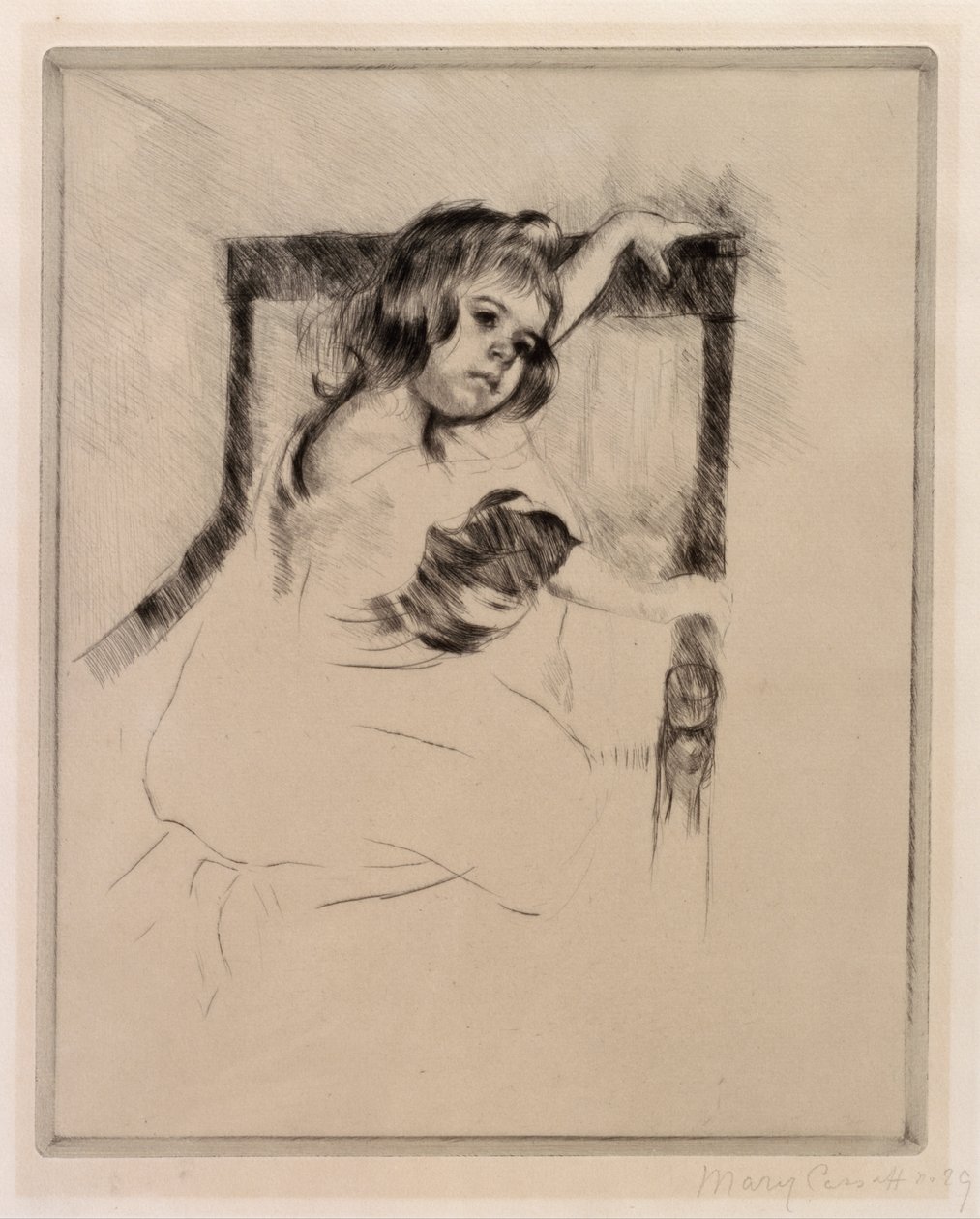 Kneeling in an Armchair av Mary Cassatt