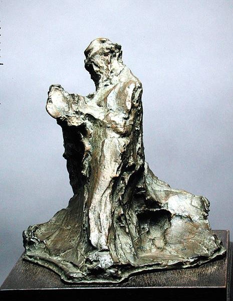 Man som läser (effekt av att en man läser tidningen) av Medardo Rosso