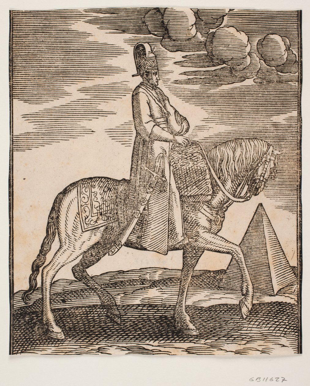Ryttare med en kolv om halsen, profil mot höger; ett svärd på hans högra sida och bagage framför honom, draperat över sadeln; till höger, i bakgrunden, en pyramid av Melchior Lorck