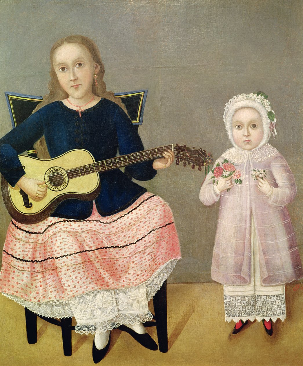 Ung flicka med en gitarr och ett barn med en bukett av Mexican School