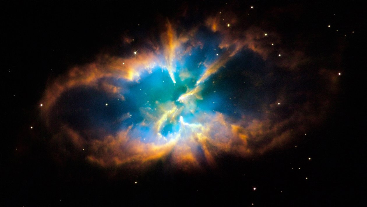 Planetnebulosa NGC 2818 i den södra konstellationen Pyxis (Kompassen). Glödande lager och skal av gas skapades när en stjärna kastade ut sina yttre lager i rymden efter att ha tagit slut på kärnkraft av National Aeronautics and Space Administration National Aeronautics and Space Administration