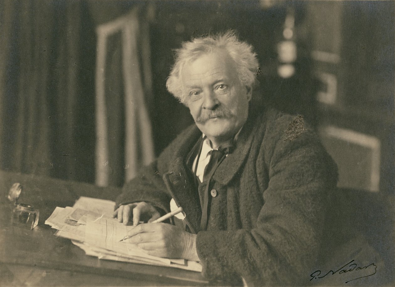 Félix Nadar sittande vid skrivbordet av Paul Nadar