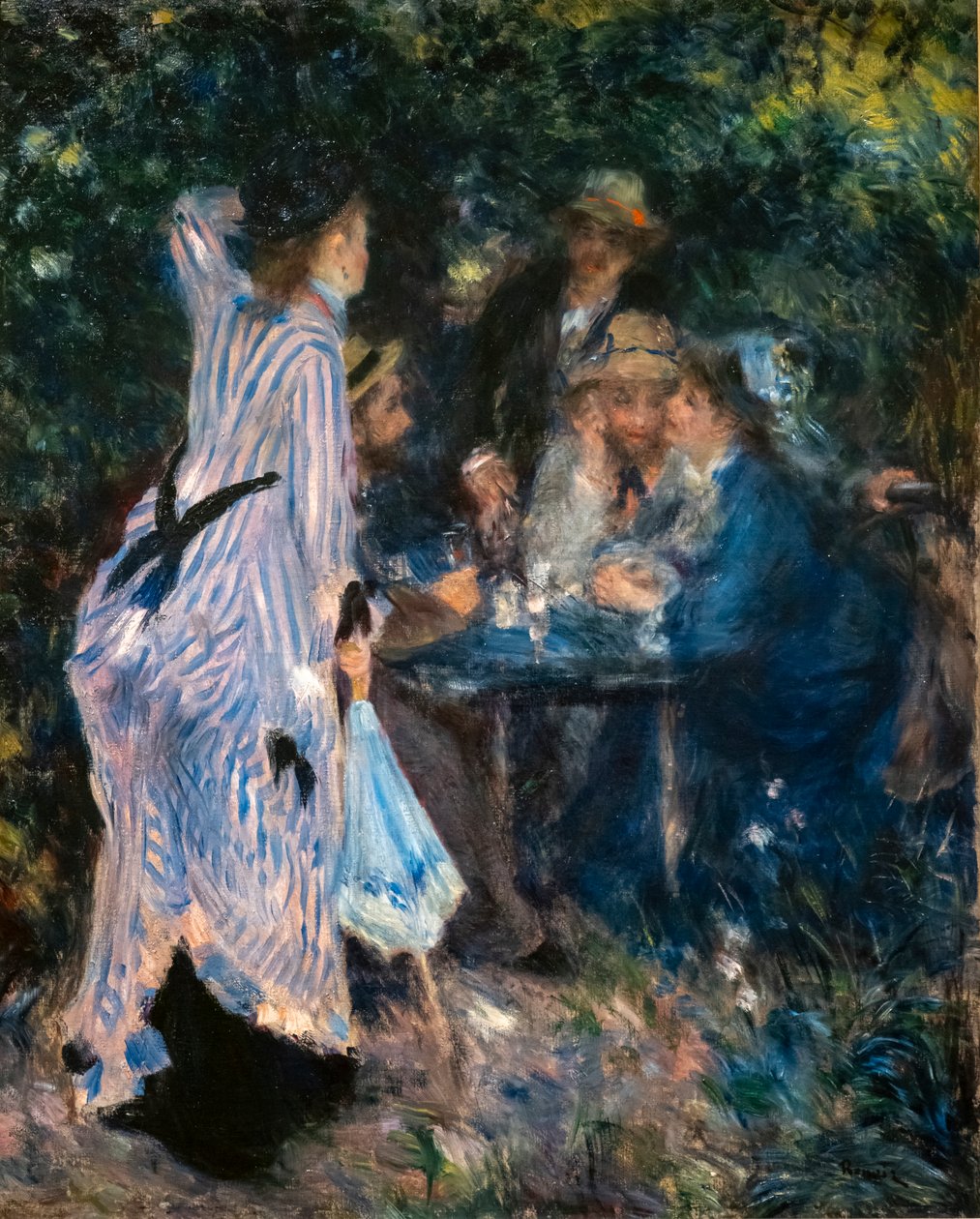 I trädgården. Under Moulin de la Galettes träd av Pierre Auguste Renoir