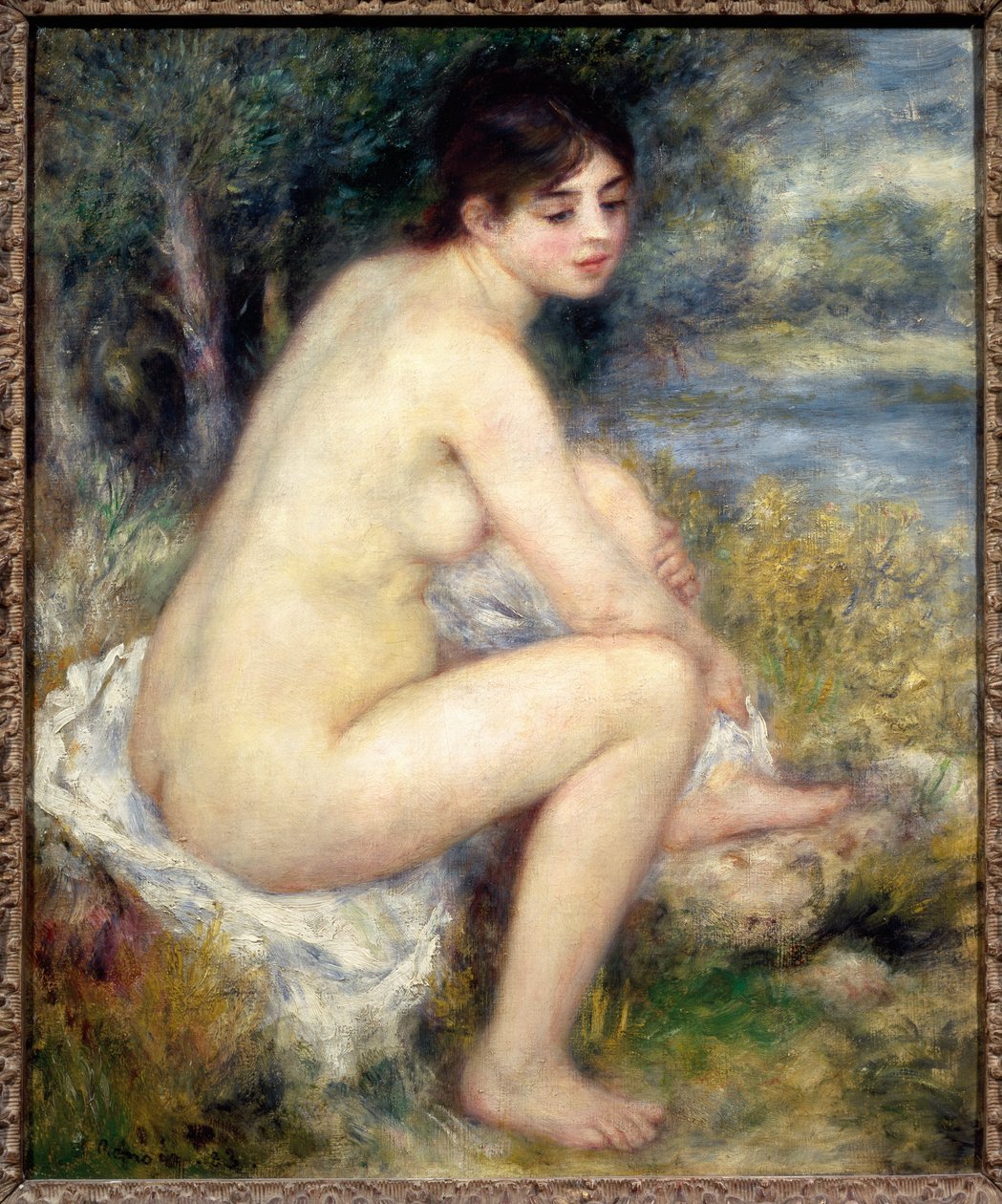 Naken kvinna i ett landskap av Pierre Auguste Renoir