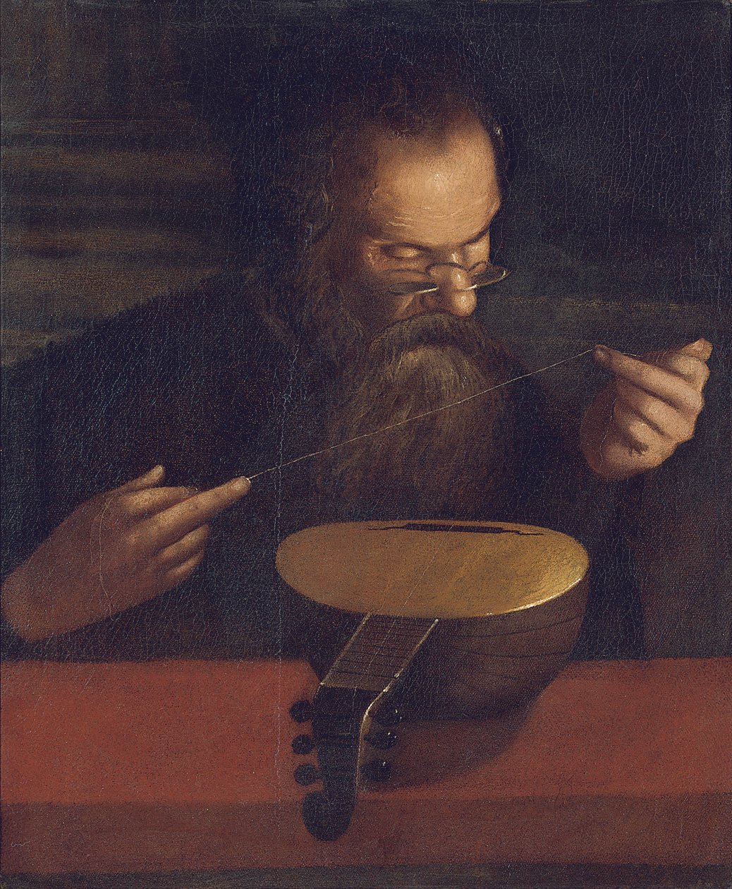 En gammal man som stränger en luta (olja på duk) av Pietro (circle of) Paolini