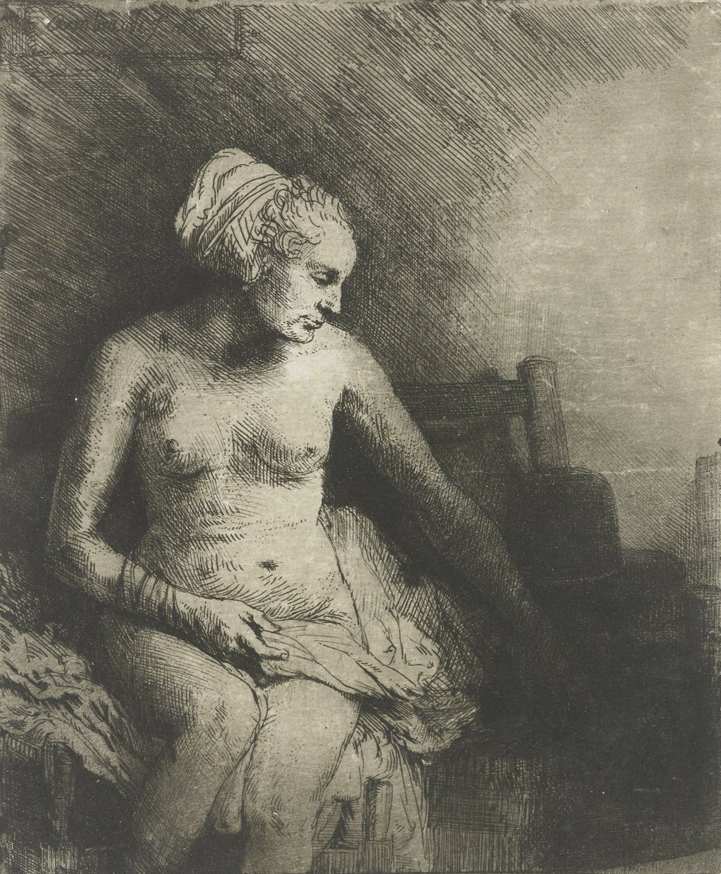 Kvinna vid badet, med en hatt bredvid sig, 1658 av Rembrandt van Rijn
