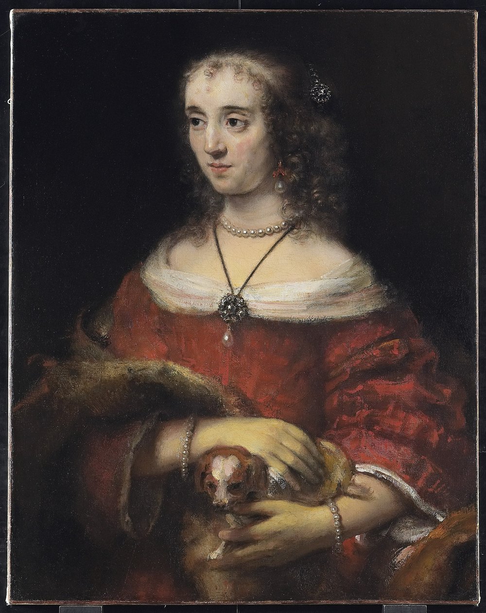 Porträtt av en dam med en knähund, c.1665 av Rembrandt van Rijn