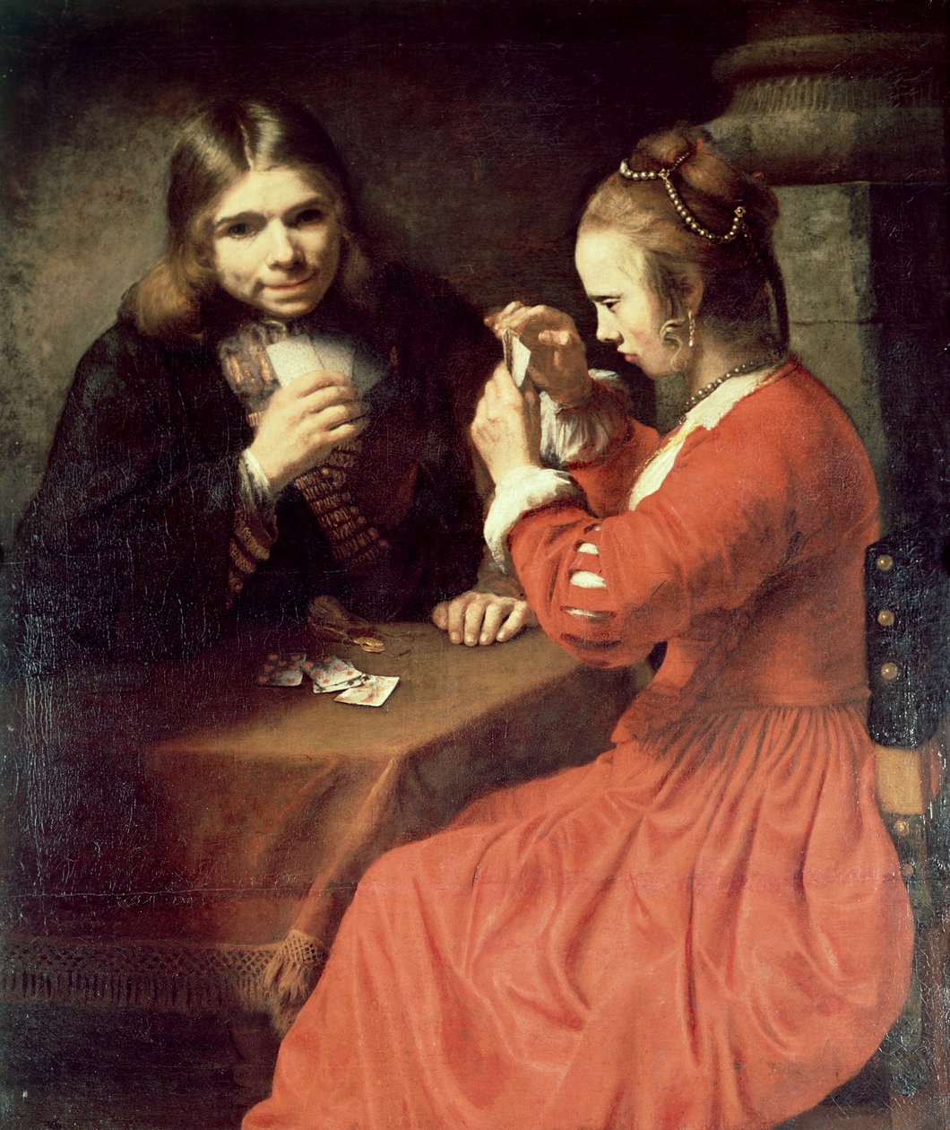 En ung man och en flicka spelar kort av Rembrandt van Rijn