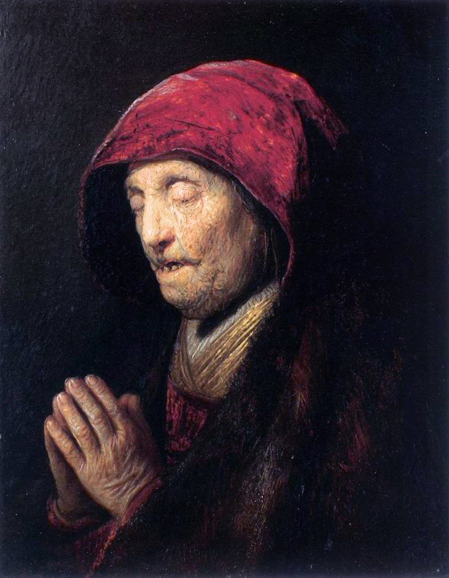 Old Woman Praying av Rembrandt van Rijn