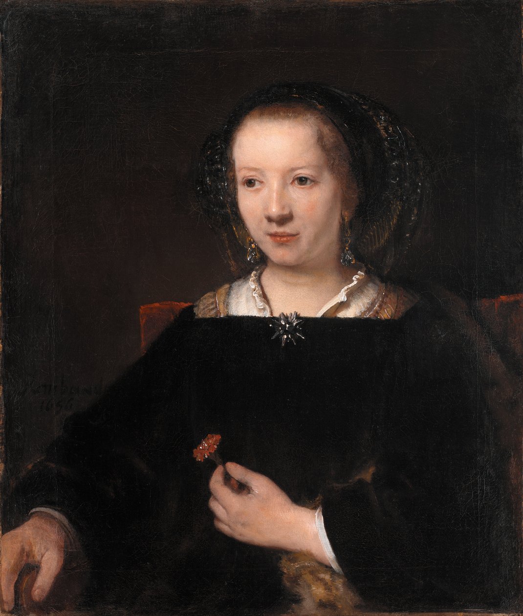 Ung kvinna med en nejlika av Rembrandt van Rijn