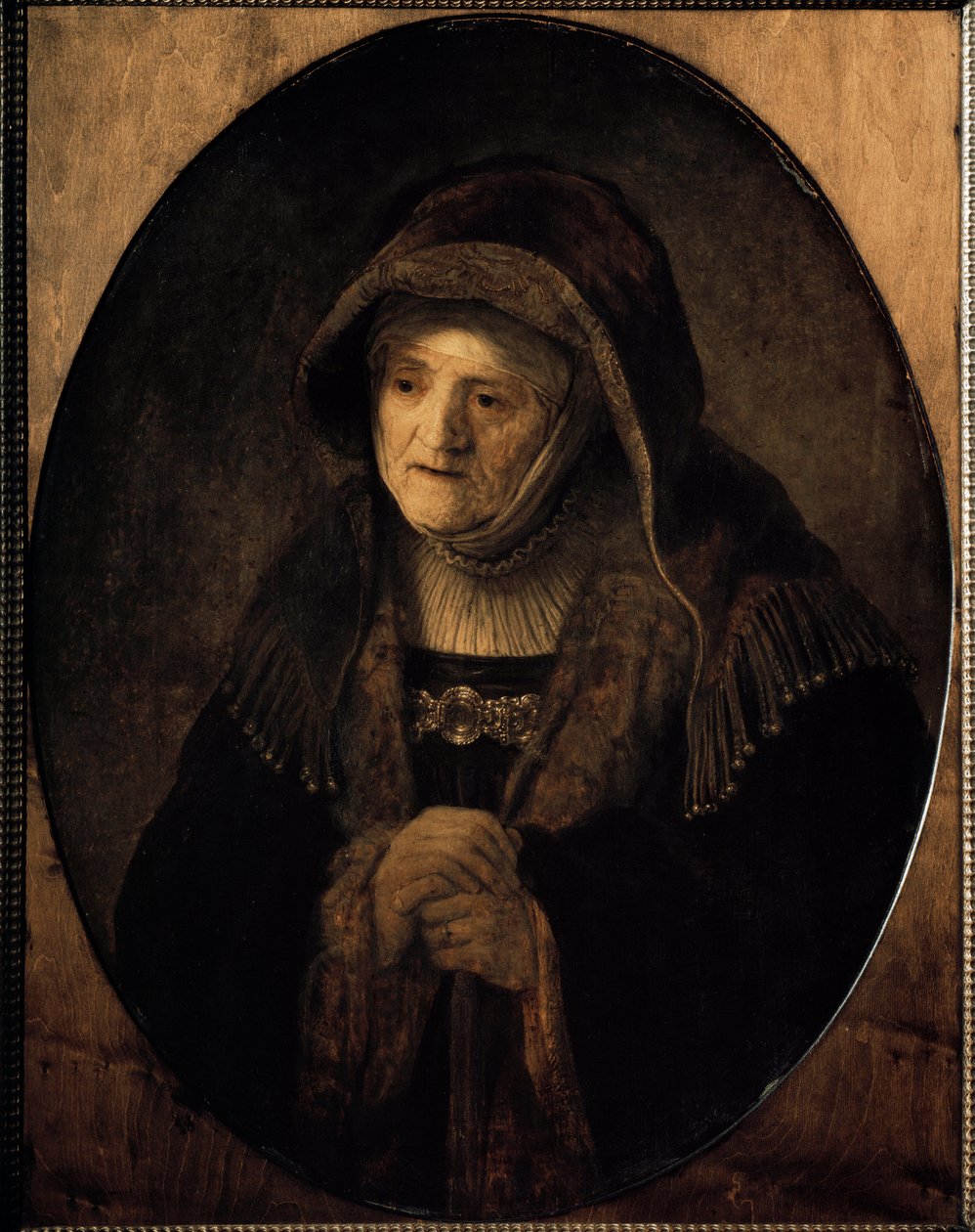 Porträtt av konstnärens mamma lutad mot sin käpp (olja på duk av Rembrandt van Rijn