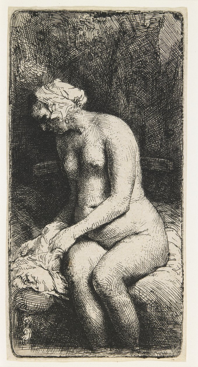 Kvinna som badar sina fötter vid en bäck av Rembrandt van Rijn