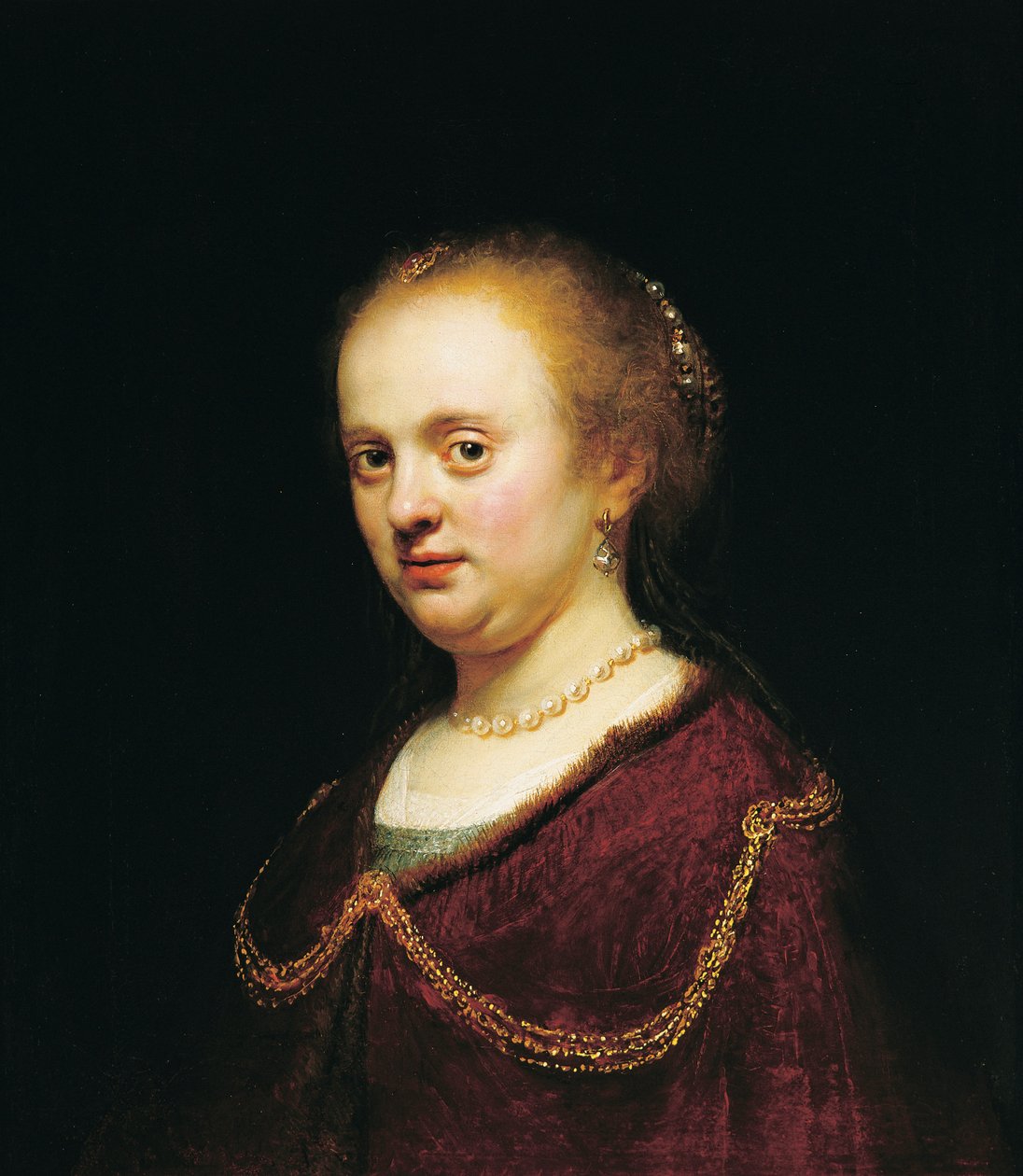 Ung kvinna med en guldkedja av Rembrandt Harmensz. van Rijn