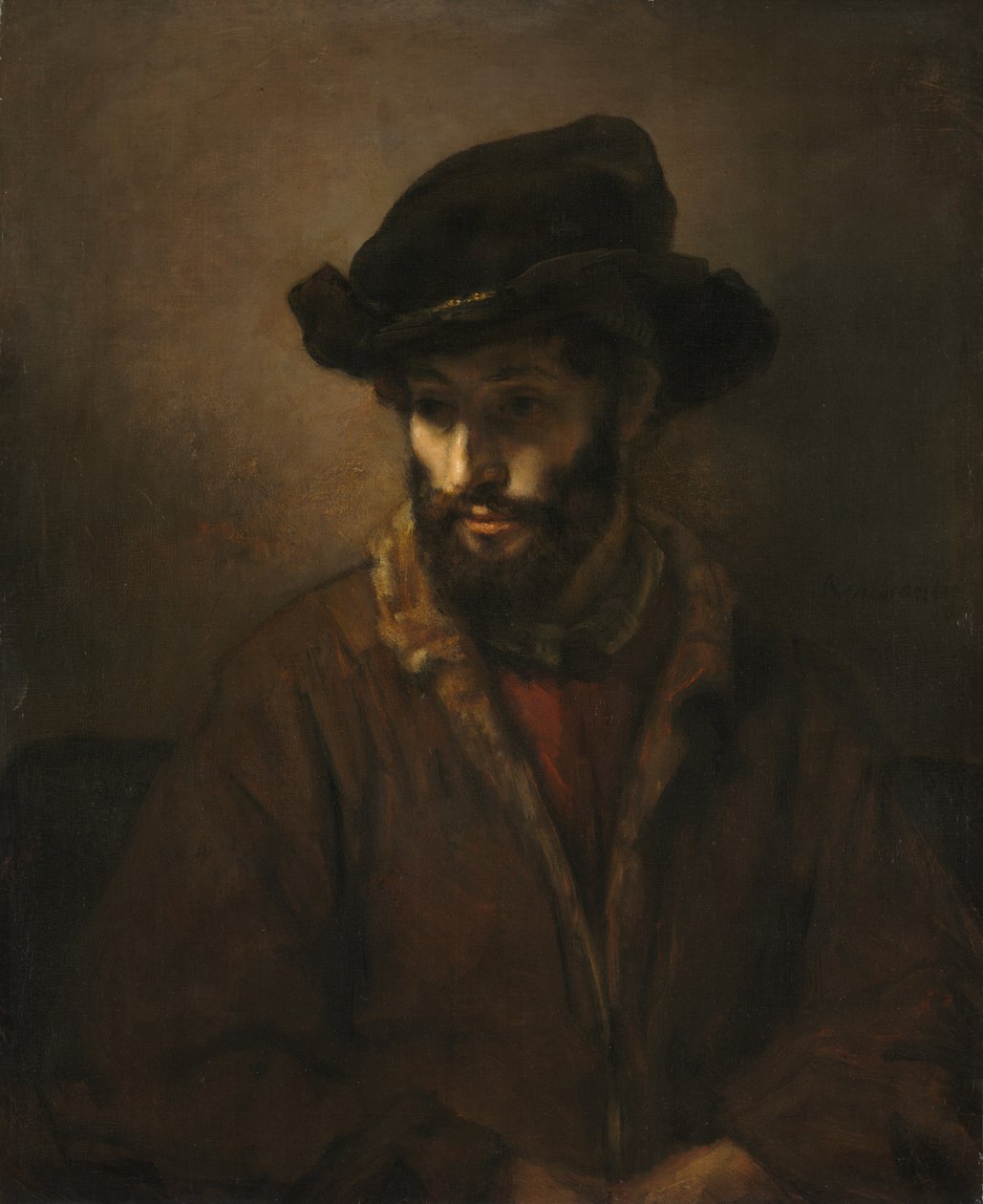 En skäggig man som bär en hatt av Rembrandt van Rijn