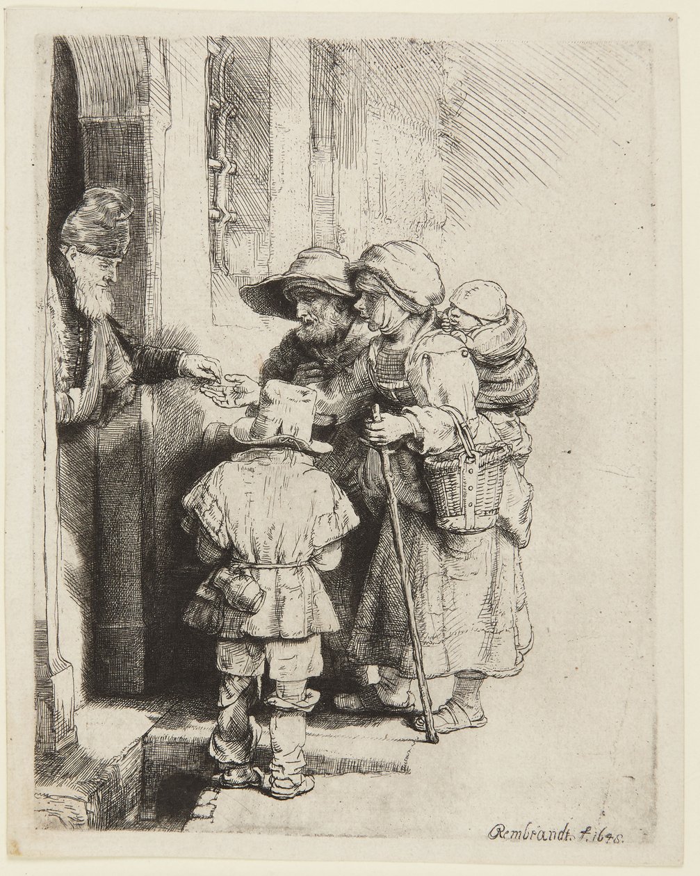 En blind vevlirare och hans familj tar emot allmosor av Rembrandt van Rijn