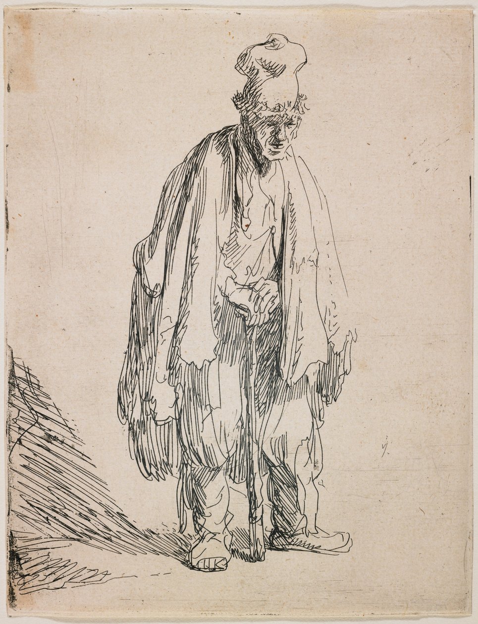 Tiggare med hög keps som stöder sig på en käpp av Rembrandt van Rijn