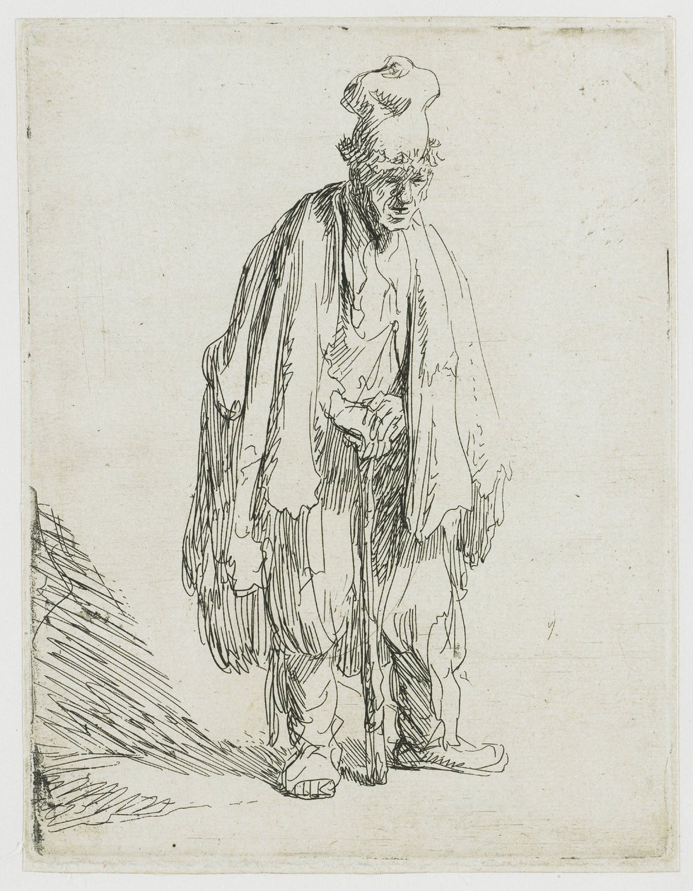 En tiggare med en hög keps, som står och stöder sig på en käpp av Rembrandt van Rijn
