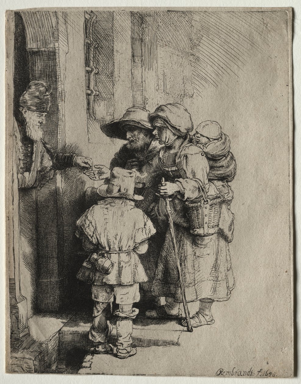 Tiggare som tar emot allmosor vid dörren till ett hus av Rembrandt van Rijn