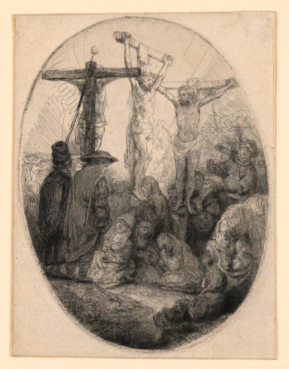 Kristus korsfäst mellan de två tjuvarna: en oval tallrik av Rembrandt van Rijn