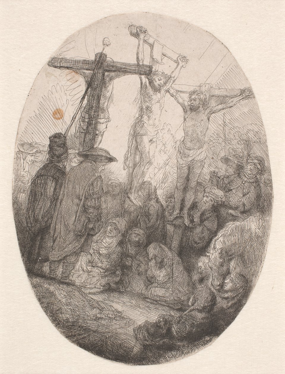 Kristus korsfäst mellan de två tjuvarna: en oval tallrik av Rembrandt van Rijn