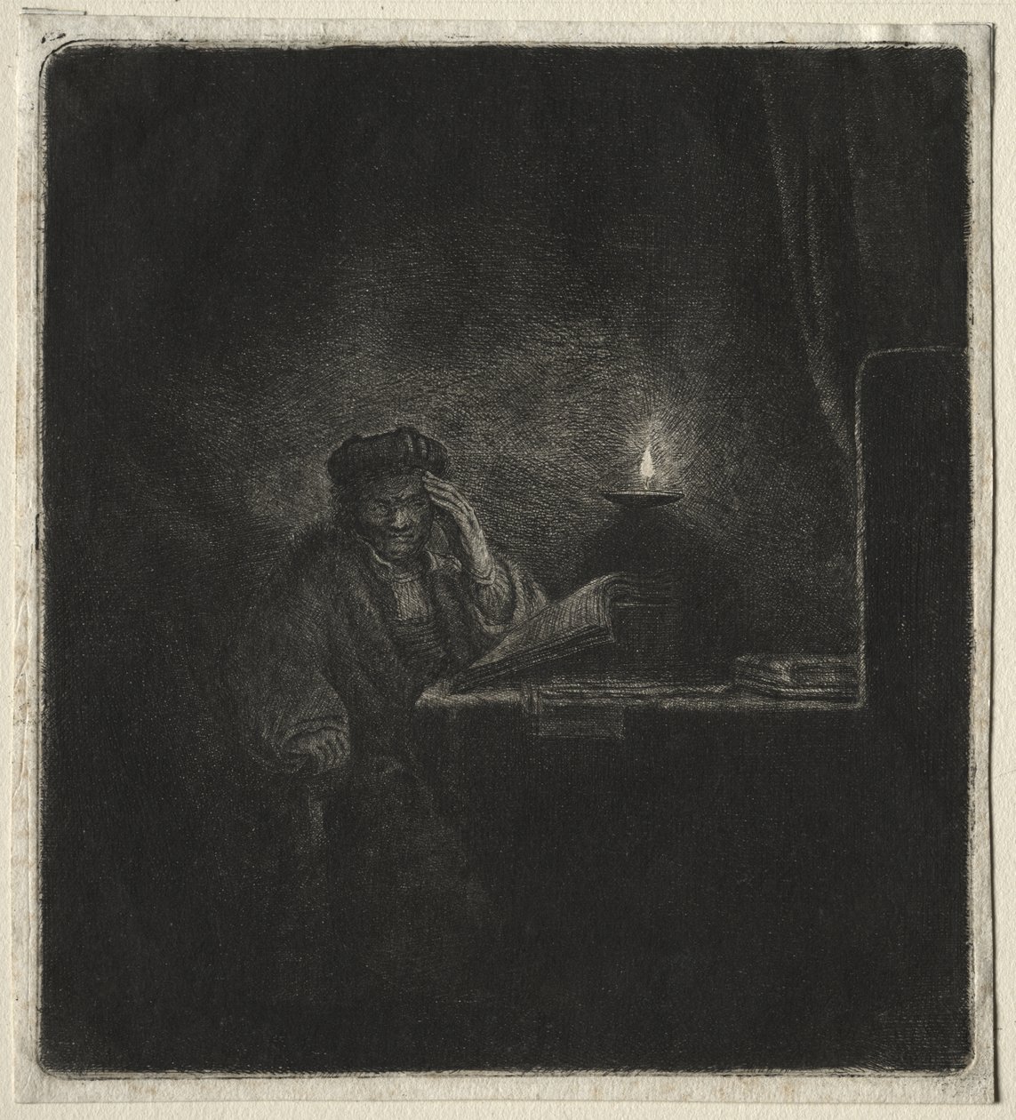 Kopia av Student vid ett bord vid levande ljus av Rembrandt van Rijn